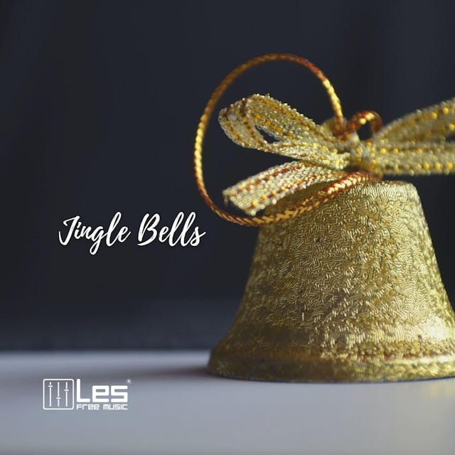 Nyd den klassiske feriemelodi "Jingle Bells" spillet på akustisk guitar.