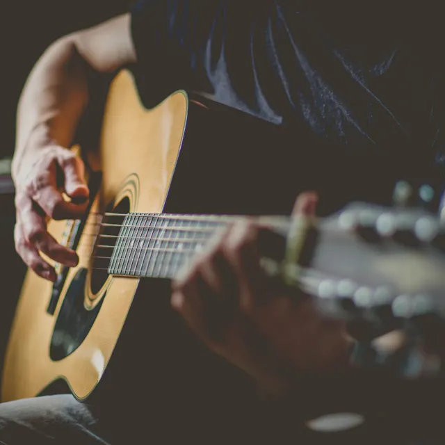 Discover "Strumming on the Guitar" - a captivating folk emotional acoustic guitar track that evokes raw emotion, transports you to a serene soundscape, and tugs at your heartstrings.